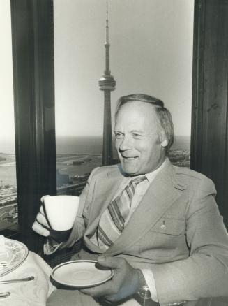 Not his cup of tea: Stuart Daw dines in the Toronto-Dominion Centre before leaving Canada. Though he still has an apartment in Etobicoke, his job is in Florida. He says Canadian federal government restricitions hamstring men of the mind - entrepeneurs like himself who are society's producers.