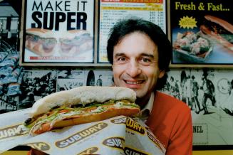 Bon Appetit: Mr. Submarine's Earl Linzon, top front, and Bernie Levinson, welcome competition from Fred DeLuca, below, and his Subway chain.