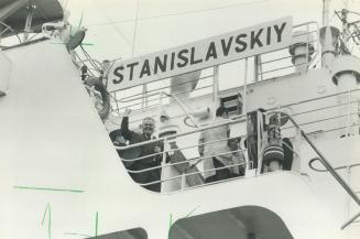 Victory at last: Wallace Edwards, who's fought to collect a $26,000 debt from the Soviet government for 13 years, raises his arms in a victory salute after the sheriff's office seized the ship at Pier 51.