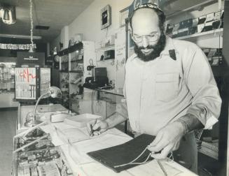 Unfinished business: Isaac Ehrlich prepares for jewelry sale and the eventual disposal of his father's jewelry store in Leaside. Ehrlich's father, Israel, who had operated the Bayview Ave. shop for 22 years, was gunned down Dec. 8. Now, says Isaac, the store holds too many memories for the family to keep it operating.