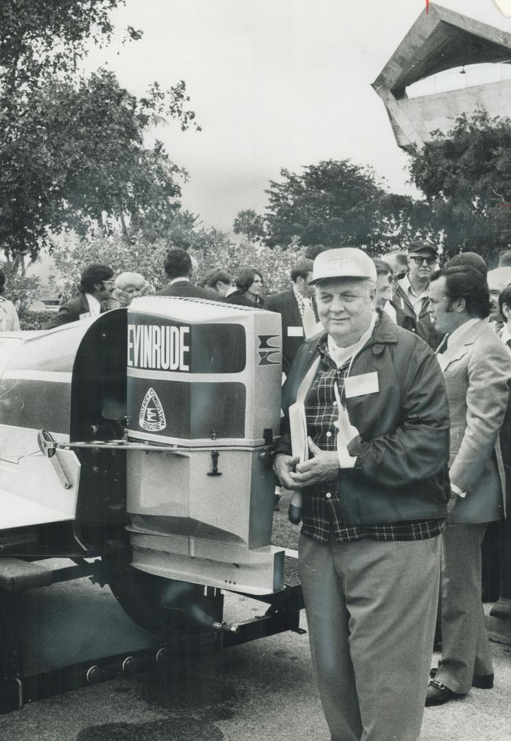 Ralph Evinrude, chairman of the board of Outboard Marine Corporation of Milwaukee and Peterborough, Ont., shows off a new 200 h.p.-plus, Wankel-type outboard motor in a demonstration at the Miami boat show. Evinrude holds a million shares of Outboard Marine stock currently trading at more than $35 a share.