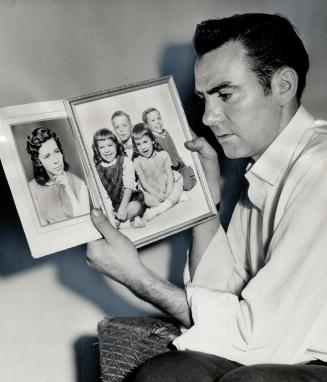They all screamed, says William Dalziel recalling the moment when the kitchen of his Niagara Falls home suddenly exploded into flame. He's holding pictures of his burned wife, and four of six children. In photo, from left: Linda, 3, David, 6, Carmen, 5, and William, 8. Other two children escaped injury.