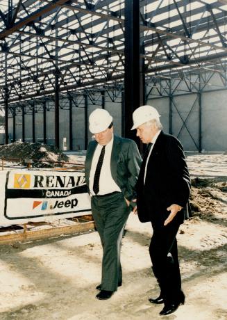 Taking shape: Jose Dedeurwaerder (right), president of American Motors Corp., tours the partly completed AMC plant in Brampton with Dennis Montone, director of the manufacturing program for the new X-58 model.