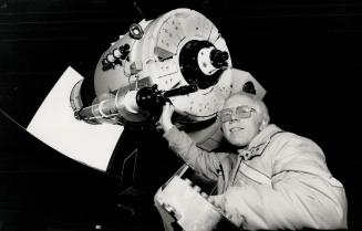 Star-Gazer: Paul Delaney mans the telescope at York University, where the general public can come Wednesday nights to take close-up pictures of the moon.