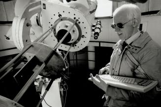 Astronomical Observations: Paul Delaney is right at home in York University's observatory. Because he's looking at sun spots, Delaney has the telescope pointed into the big star itself, in order to get some flare on the lens.