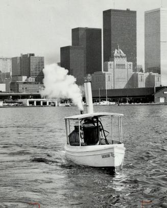 Professor Fred DeLory, (above) who teaches civil engineering at University of Toronto, restored 60-year-old steamboat from a Connecticut estate and it now chugs around Toronto harbor, attaining speeds up to 9 m.p.h. It's still unnamed.