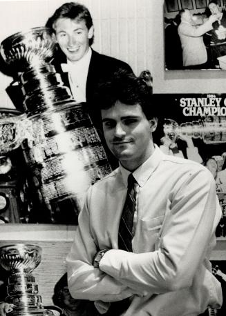 Hockey fan: Jeff Denomme, a recent graduate of Durhan College's sports administration program, poses in the Hockey Hall of Fame, where he is director of special projects.