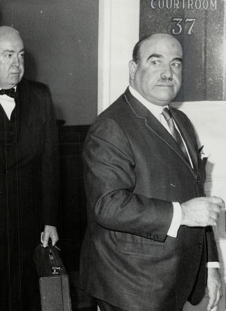 Reuben Dennis, one of Metro's largest developers, leaves courtroom where he and six companies pleaded guilty to making false statements in income tax returns.