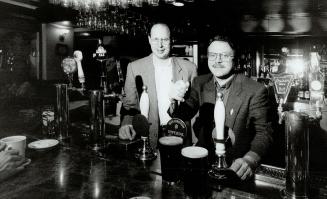 Cheers: Bob Desautels, right, and Tim Smith find their pubs featuring local wine and beer are popular.