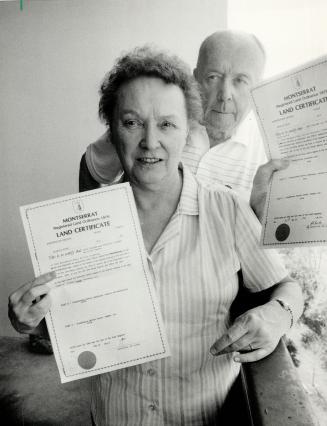 Justice delayed: Patricia and Jack Dillman of Scarborough show the deeds they received yesterday for two lots on the Caribbean island of Montserrat. They bought them in 1962.