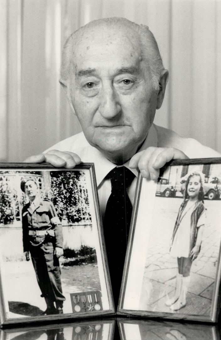 Memories remain: Gustav Dorovin holds a photo of himself as a World War II soldier and a photo of his daughter, Irene, taken at age 7. She was later killed by the Nazis.
