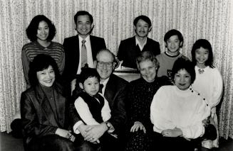 One big family: At back, from left, Thu (Anne) and Duc Vuong, Thanh, Wey and Trinh. At front, from left, Mai and Gordon Vuong, on Gordon Duff's lap, Elva Duff and Huong Trinh.