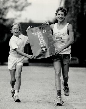 Remembering the dream: Tom Duck, 16, right, and his brother, ken, 14, prepare for the Terry Fox run Tom is organized in King City.