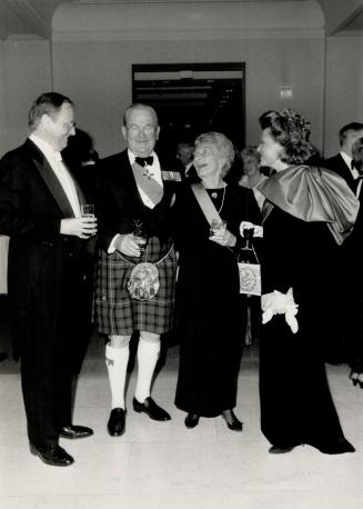 At left, Rosenthal Jewellery proprietor Philip Taylor and Elizabeth Taylor, right, enjoy a conversation with Andrew Duncanson, grand prior of the order, and Harryette Duncanson.