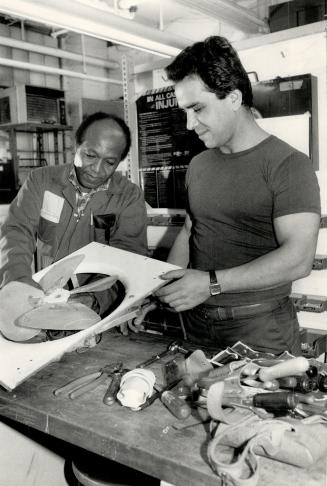 Handyman Paul Dunstan (left) is annoyed because he now lags far behind rate paid skilled craftsmen such as electrician Sam lannuzzi (right).
