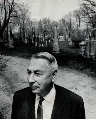 George Durdy inspects grounds of St. James Cemetery, His cemetery, Toronto's oldest, holds the remains of 62,441 citizens.
