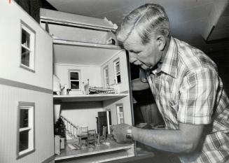 A builder's pride: Alex Dyce takes only two or three months to build a house - a dollhouse, that is. Retirement from the Metro Police force will give him more time to devote to his hobby.