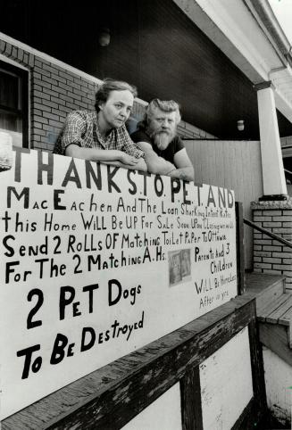 Castle no more?, Fran and Chuck Edwards stand on the porch of their Pape Ave. house, decorated with a message to the federal Liberals.