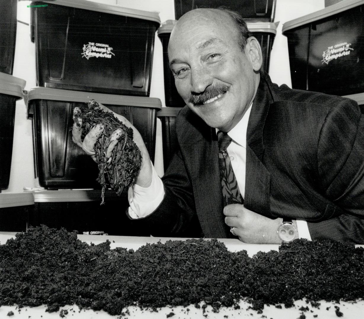 Earthy Friends: Albert Eggen holding wigglers which do all the work in his composter.