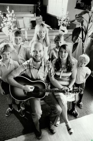 Singing family: Ren and Suzanne Elgie sing at Pine Ridge Presbyterian Church with their children, from left, Christopher, 8, Justin, 10, Angela, 12, Victor, 9 and Nicholas, 6. The family lives for nine months of the year in a poor area of Pueblo, Mexico.