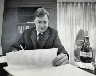 Reviving the giant: Paul Jacobus Erasmus, the 38-year-old bachelor president of Canadian Breweries Ltd., would like to find more time to spend on the finer details of investing $55 million which Canadian Breweries has available. He is leading the fight to life the beer giant from its present economic doldrums. His major task now, however, is to sell more beer in Canada and the United States.