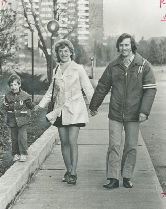 Second marriage for Shirley and Al Fingler is happy. With Danny, 6, Fingler's son from his first marriage, the family enjoys a walk by their north Metro apartment building. Experts believe couples married for the second time usually have a more open relat