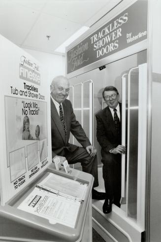 Off the beaten track: Larry Furiong, left, who's been in the plumbing business 39 years, and Fred Ollie have developed and are marketing a trackless shower door for the do-it-yourself market.