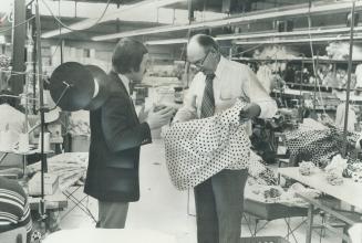 Former manufacturer Joe Feldman, right, founded the Needle Trade Management Association of Ontario to improve management in the garment industry. Now a consultant for apparel markers, he talks to Peter Jackson, director of engineering in the Pegasus Shirt