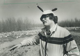 Academic Huck Finn: Zoology researcher Peter Fetterolf, who is studying gulls on the Leslie St. split, wears feathers in his cap to protect himself from dive-bombing gulls guarding their turf. They attack the feathers and miss your head, says the scient