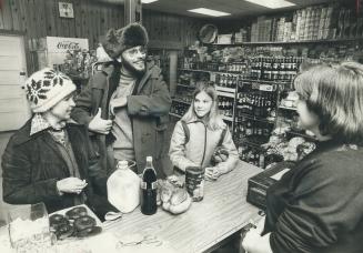 We used to drive downtown to do our shopping, says architect and planner Blandford Gates, with his wife Marja, left, and daughter Niina, 12, right, chatting at the corner store with Sharon Vignjevic. Then we noticed that when we needed winter goods, the d