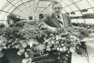 Checking plants in one of Humber College's greenhouses, Russ Geddes says right now, there are more jobs than graduates of the college's two-year retail floracultural program he runs - the only one of its kind in Canada. Geddes, who has two sons, says he c