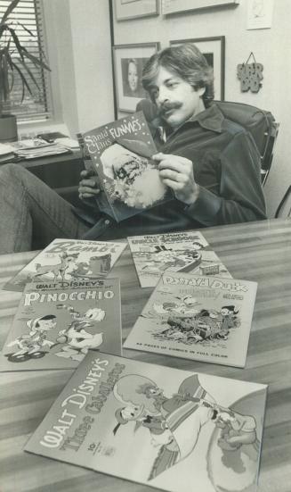 Comics a shrewd investment: Richard Foster looks over some of the comic books from a collection he values at $25,000. Foster keeps his comics at the bank and takes them out periodically so he can have the fun of re-reading them. He compares owning comic b