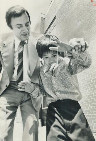 Tips from the champ, Al Gallow, may help this little boy grow up to be a Yo-Yo demonstrator when he's a teenager. Gallow's company hires 15 youths to demonstrate Yo-Yos across Canada each summer and he says job pays well.