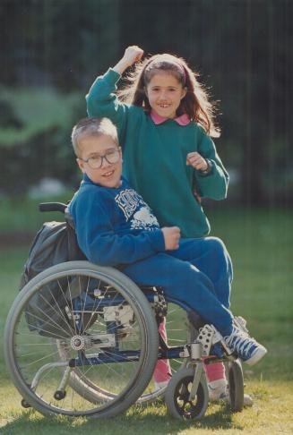 Jeremy Gismondi, 12, is one of thousands of disabled children in Ontario who go to summer camp each year. While his siter, Jolie, listens in, Jeremy recalls last year's camping joys.