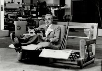 Off his feet: William Gerth, designer and vice-president of manufacturing at Waterloo Spring Co. Ltd., relaxes in one of his firm's products. His company, which designs and manufactures springs and mechanisms for furniture such as bed-chesterfields, displ