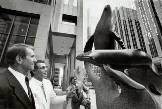 Three Tonnes of Art. Alastari Fernie, left, president of Standard Life, discusses the sculpture Megapters, which the company commissioned for its Toronto office, with the sculptor, George Schmerhoiz, and Ed Quigg, Standard LIfe's vice-president, property