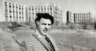 Anthony Ferracuti, 37, in charge of design reserach and firm administration for Kelton architects planners for the last 15 years, is shown above in the foreground of the Masters, a $32 million condominium apartment project at Burnhamthorpe and Mill Rd., E