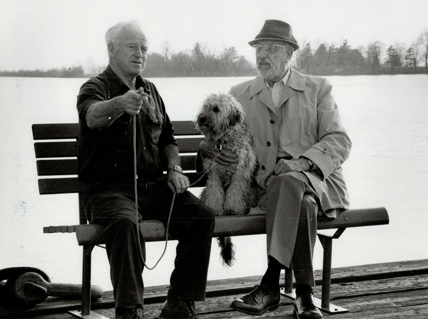 These two men used to be rivals. John Goodchild, left with dog Sam, was a rumrunner and Carl Farrow was Windsor's police chief in those days. Now they're good friends.