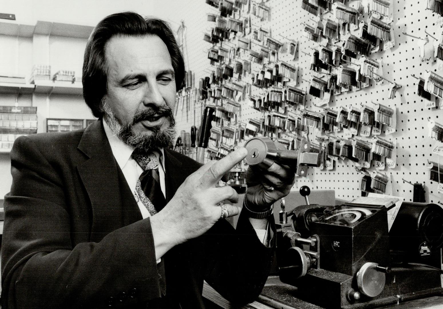 Custom cut: Arthur Frderico, Toronto branch manager for Reilly Lock, displays some of the locks and keys his company offers including an $8 pick-proof deadbolt. Reilly's sales which last year reached $1.5 million are on the increase this year as homowners