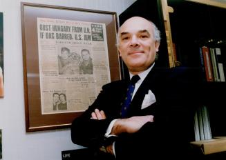Bela Fejer: Now a lawyer, he's spent years trying to get Canadians to invest in Hungary. He's shown with framed Toronto Star front page of Dec. 8, 1956, which was a catalyst in his life.