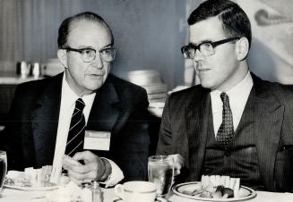 Austerity lunch of soup and sandwiches contrasted with the news from Texasgulf chairman Charles F. Fogarty (left) yesterday. The chief executive was telling Toronto Society of Financial Analysts about record earnings and a minor gold discovery at giant ba