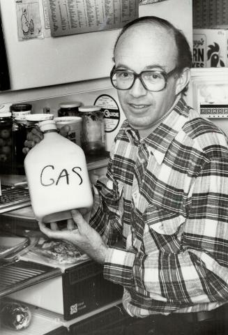 Unwelcome surprise: Reader Arthur Forer holds jug of milk with the word gas marked on it