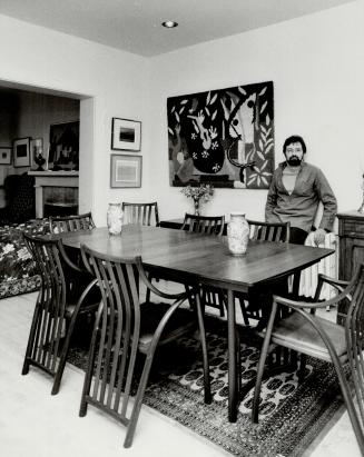 Custom flt: Furniture designer Michael Fortune with the dining set he crafted for Judy and Michael John