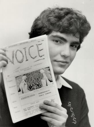 Voice stilled: Paul Fraschetti, 17-year-old editor, holds the issue of school paper which was cancelled because principal ruled some articles were contrary to views of the Catholic Church