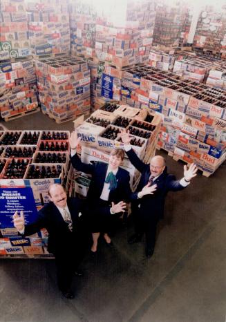 John Fraser (R) Lynne McDonell (l) and Terry Mercer world record bottles and Cans