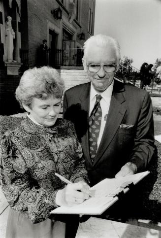 Grave error: Petition organizer Tom Gallagher signs up Mary Ann Chesser (left). Above, Irish peasants being evicted during the Great Potato Famine.