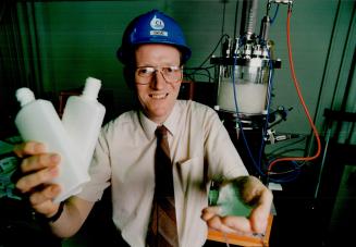 Green bottle: ICI manager David Gannon shows off plastic bottles that will disintegrate when tossed on a compost heap.