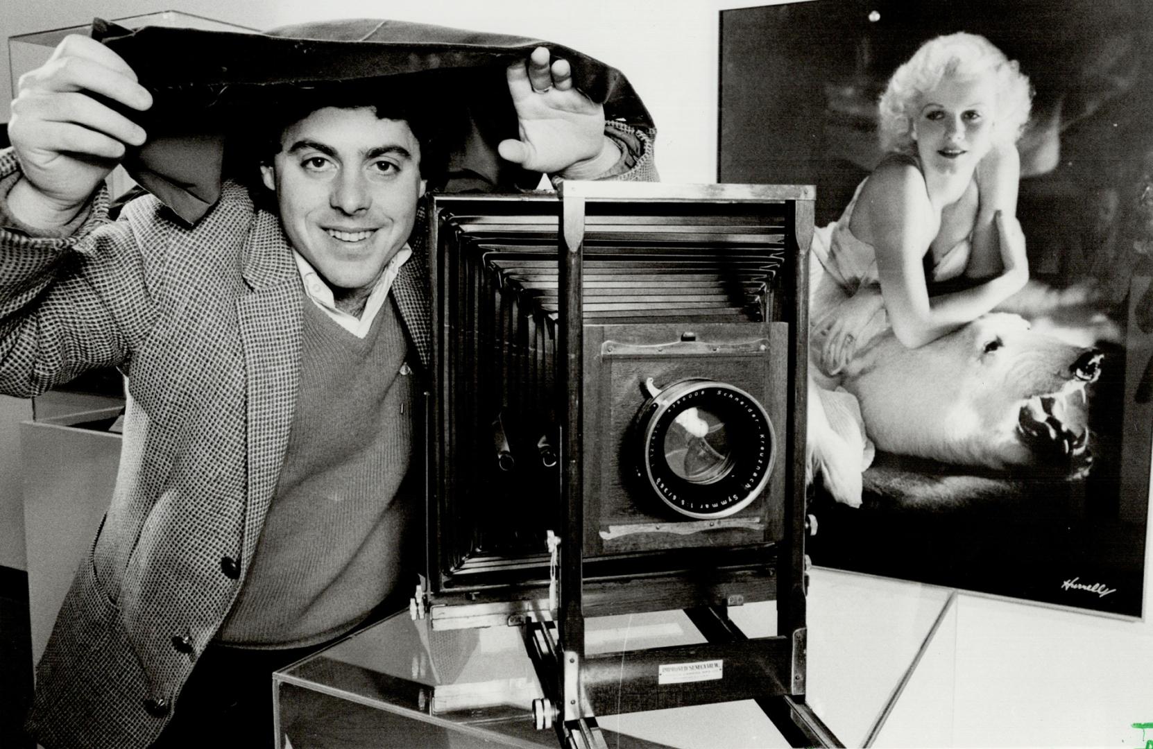 Fuctioning museum piece: Michael Gilbert, who runs the Canadian Centre of Photography, poses with an 11 x 14 (negative) field camera which he has fitted with a modern lens