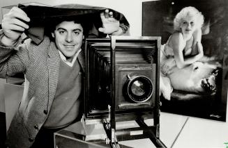 Fuctioning museum piece: Michael Gilbert, who runs the Canadian Centre of Photography, poses with an 11 x 14 (negative) field camera which he has fitted with a modern lens