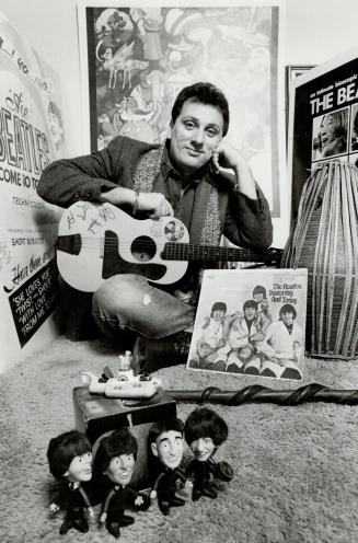 Beatle fan: Geoffrey Giuliano sits in his living room surrounded by Beatle memorabilia